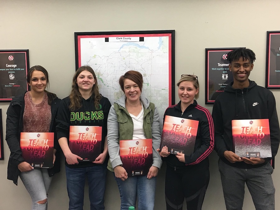 Teach One to Lead One students with mentor curriculum